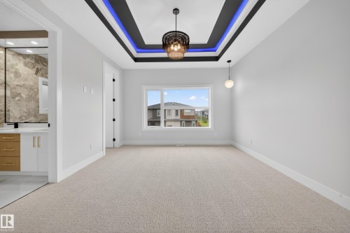 Recessed tray ceiling with integrated lighting - 8737 Mayday Lane Sw, Edmonton, AB 