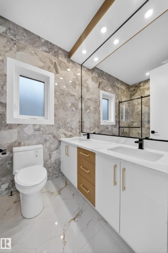Dual vanity with integrated sinks and white countertops - 8737 Mayday Lane Sw, Edmonton, AB 