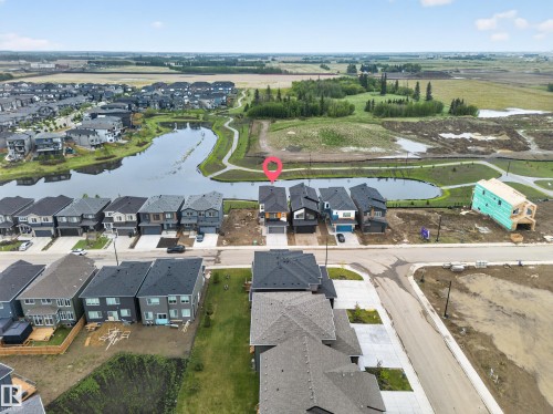 Contemporary residential architecture with a neutral color palette - 8737 Mayday Lane Sw, Edmonton, AB 