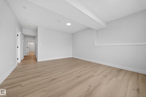 Recessed lighting, wood-finish flooring, white walls, and white trim - 8737 Mayday Lane Sw, Edmonton, AB 