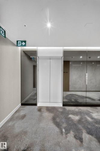 Elevator access with white doors, recessed lighting, and patterned carpeting - #4007 10360 102 St Nw, Edmonton, AB 