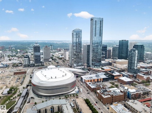 Urban skyline featuring multiple high-rise structures, a prominent arena, and surrounding city infrastructure - #4007 10360 102 St Nw, Edmonton, AB 