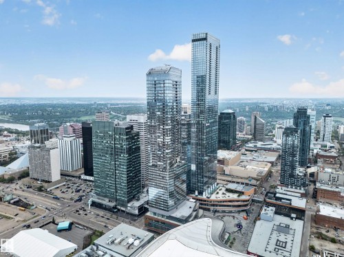 Urban landscape featuring multiple high-rise structures, extensive city infrastructure, and a distant river - #4007 10360 102 St Nw, Edmonton, AB 