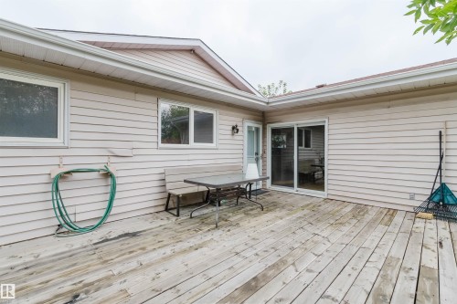 Expansive wood deck with a sliding glass door and an additional exterior door - 2439 112 Street Nw, Edmonton, AB - Outdoor With Exterior