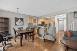 Wood-finish flooring, recessed lighting, and a stainless steel appliance suite - 