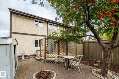 Patio area featuring brick pavers and a built-in lattice privacy screen - 716 Clareview Rd Nw, Edmonton, AB 