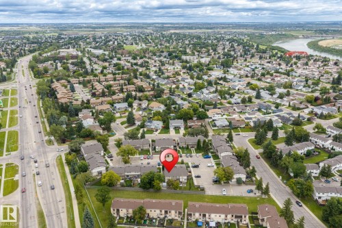 Aerial perspective showcasing the residential area, adjacent to a major roadway, and bordered by a river - 716 Clareview Rd Nw, Edmonton, AB 
