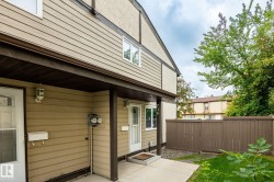 Exterior with horizontal siding, stucco elements, and individual unit entry - 