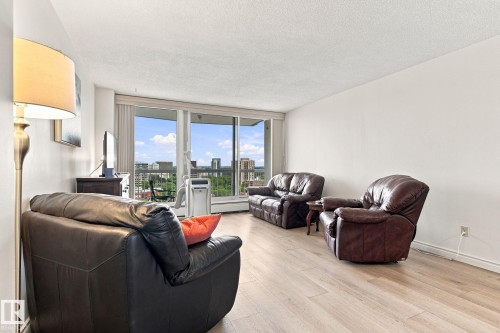 Light wood-finish flooring with white walls and ceiling - #1507 9835 113 St Nw, Edmonton, AB 
