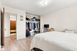 Wood-finish flooring throughout, integrated closet organization system, recessed ceiling light fixture, and solid core interior door - 