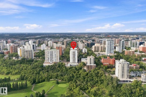 Aerial perspective showcasing a dense urban landscape with extensive tree coverage and a golf course - #1507 9835 113 St Nw, Edmonton, AB 