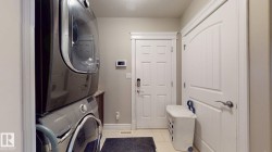 Light-toned wall paint, white trim, and a paneled door - 