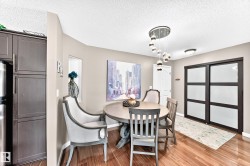 Wood-finish flooring with a modern pendant light fixture - 