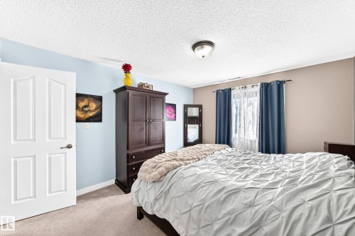 Carpeted flooring, recessed window, and flush mount ceiling light fixture - #418 279 Suder Greens Dr Nw, Edmonton, AB 