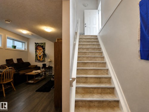 Staircase with tile-finish risers and treads - 13309 128 Street Nw, Edmonton, AB 