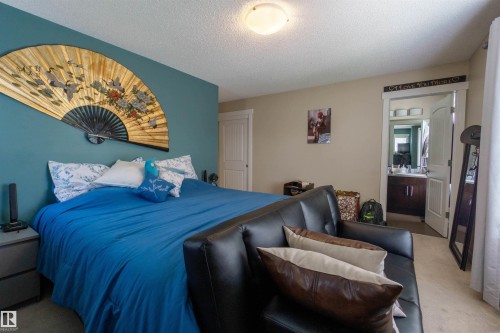 Carpeted flooring, neutral wall tones, and an attached door frame - #75 8315 180 Av Nw, Edmonton, AB 