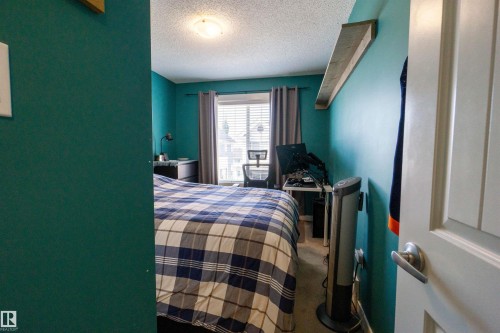 Recessed window with blinds and drapes - #75 8315 180 Av Nw, Edmonton, AB 