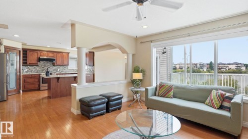 Living area with wood-finish flooring, a ceiling fan, and recessed lighting - 6116 53 Avenue, Beaumont, AB - Indoor