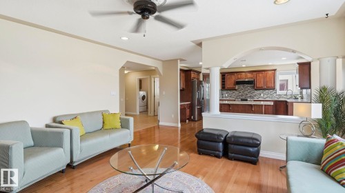 Open-concept living area featuring wood-finish flooring, recessed lighting, and a ceiling fan - 6116 53 Avenue, Beaumont, AB - Indoor Photo Showing Living Room