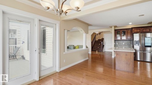 Hardwood flooring throughout the main living areas - 6116 53 Avenue, Beaumont, AB - Indoor Photo Showing Kitchen