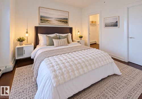 Hardwood-finish flooring, recessed lighting, and a closet with wire shelving - #605 10152 104 St Nw, Edmonton, AB 