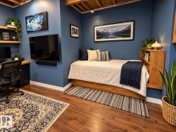 Wood-finish flooring, built-in desk with wood countertop, recessed lighting, and exposed ceiling joists - 