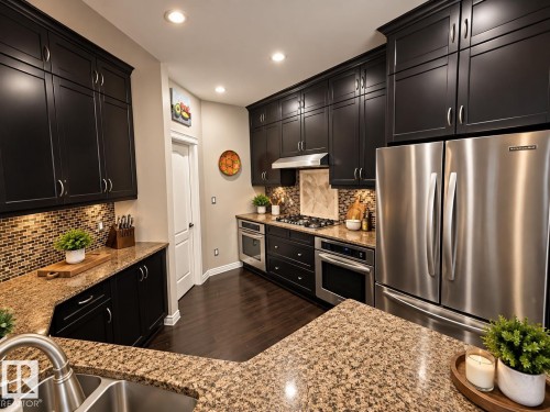 Kitchen featuring dark wood-finish cabinetry, stainless steel appliances, granite-style countertops, mosaic tile backsplash, and recessed lighting - 16893 58A Street Nw, Edmonton, AB 