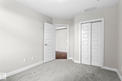 Light gray wall paint complemented by white trim and a neutral carpet - 