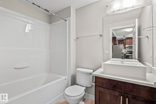 Bathroom featuring a white tub and shower combination with a single-handle faucet - 5151 Windermere  Bv Sw, Edmonton, AB - Indoor Photo Showing Bathroom