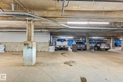 Underground parking structure featuring concrete floors and columns - 