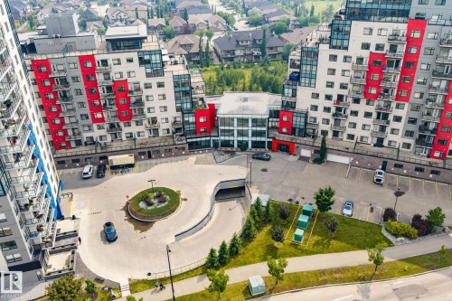 Contemporary residential buildings featuring red and white paneling with glass balconies - 5151 Windermere  Bv Sw, Edmonton, AB - Outdoor With View