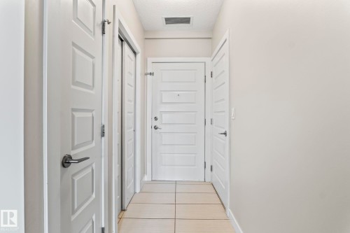 Neutral wall tones complemented by white trim and doors - 5151 Windermere  Bv Sw, Edmonton, AB - Indoor Photo Showing Other Room