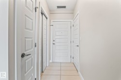 Neutral wall tones complemented by white trim and doors - 