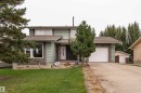 Two-story residence featuring green siding and stone accents - 17928 93 Ave Nw, Edmonton, AB 