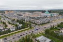 Aerial perspective showcasing a major commercial complex with extensive parking areas, multiple large-scale buildings, and surrounding residential properties - 17928 93 Ave Nw, Edmonton, AB 