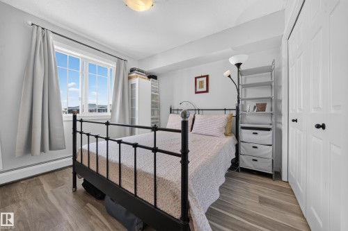 Recessed lighting, wood-finish flooring, and white paneled doors - #419 920 156 St Nw, Edmonton, AB 