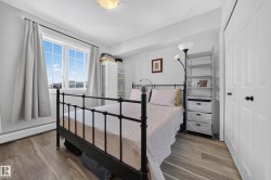 Recessed lighting, wood-finish flooring, and white paneled doors - 