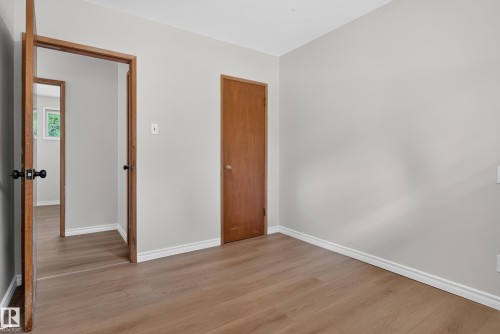 Wood-finish flooring with light gray walls and white trim - 2 Grandora Crescent, St. Albert, AB 
