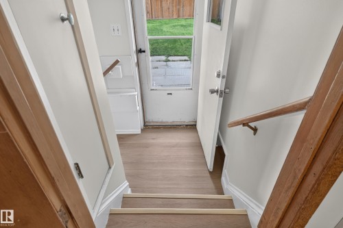 Wood-finish flooring at the base of the staircase - 2 Grandora Crescent, St. Albert, AB 