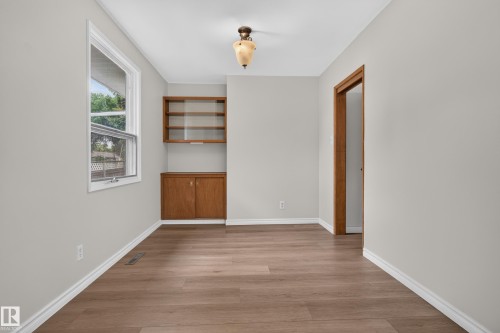 Wood-finish flooring with white baseboards - 2 Grandora Crescent, St. Albert, AB 