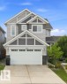 Contemporary exterior with multi-level gable roofs, light and dark gray siding, and stone accents - 4530 Saly Place Sw, Edmonton, AB 