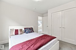 Light-colored carpeting, white walls, and a recessed light fixture - 