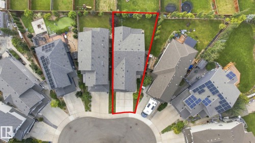 Curb-side property on a cul-de-sac featuring an attached garage and a multi-level roof - 4530 Saly Place Sw, Edmonton, AB 