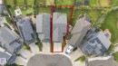 Curb-side property on a cul-de-sac featuring an attached garage and a multi-level roof - 4530 Saly Place Sw, Edmonton, AB 