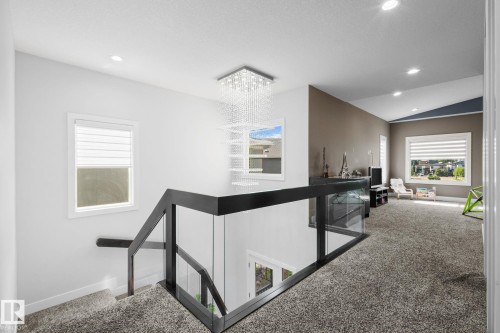 Modern glass and dark-finish railing system - 2019 Ware Rd Nw, Edmonton, AB 