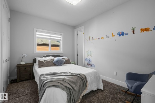 Carpeted flooring, white trim, recessed lighting, and a window with blinds - 2019 Ware Rd Nw, Edmonton, AB 