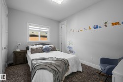 Carpeted flooring, white trim, recessed lighting, and a window with blinds - 
