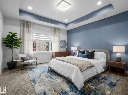 Recessed lighting, a tray ceiling, and a large window with blinds and sheer curtains - 2019 Ware Rd Nw, Edmonton, AB 