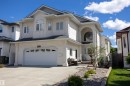 Stucco exterior with an arched entry porch - 6407 163 Avenue Nw, Edmonton, AB 