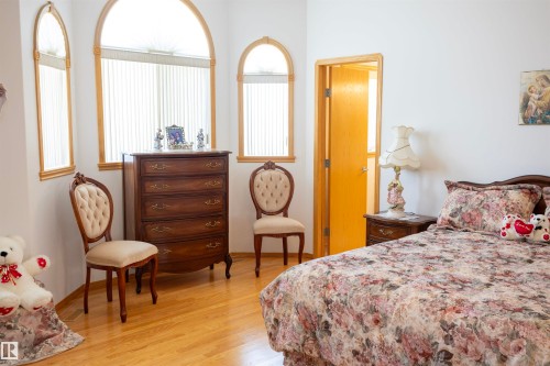 Room featuring light wood-finish flooring, white walls, and a light wood door frame - 6407 163 Avenue Nw, Edmonton, AB 